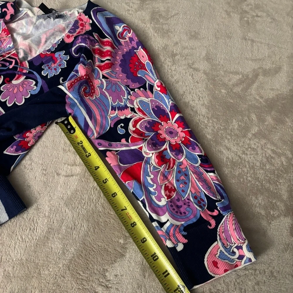 Talbots floral patterned, 3/4 sleeve knit top with a v-neckline and side slits.